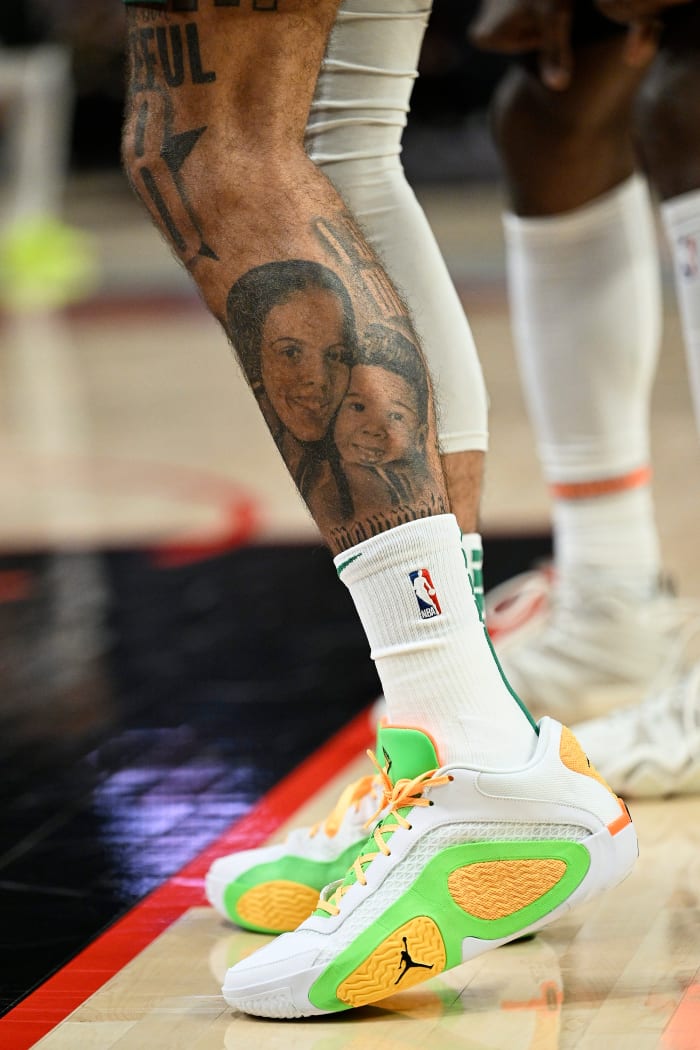 Boston Celtics forward Jayson Tatum's white and green Jordan Brand sneakers.